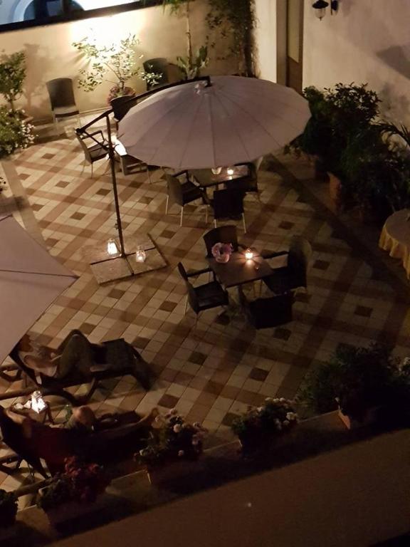 Patio nebo venkovní prostory v ubytování Palazzo Volta Boutique Luxury B&B