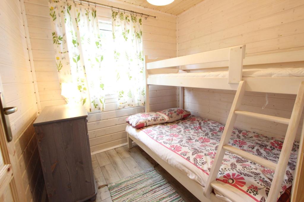 Postel nebo postele na pokoji v ubytování Czerwone Korale