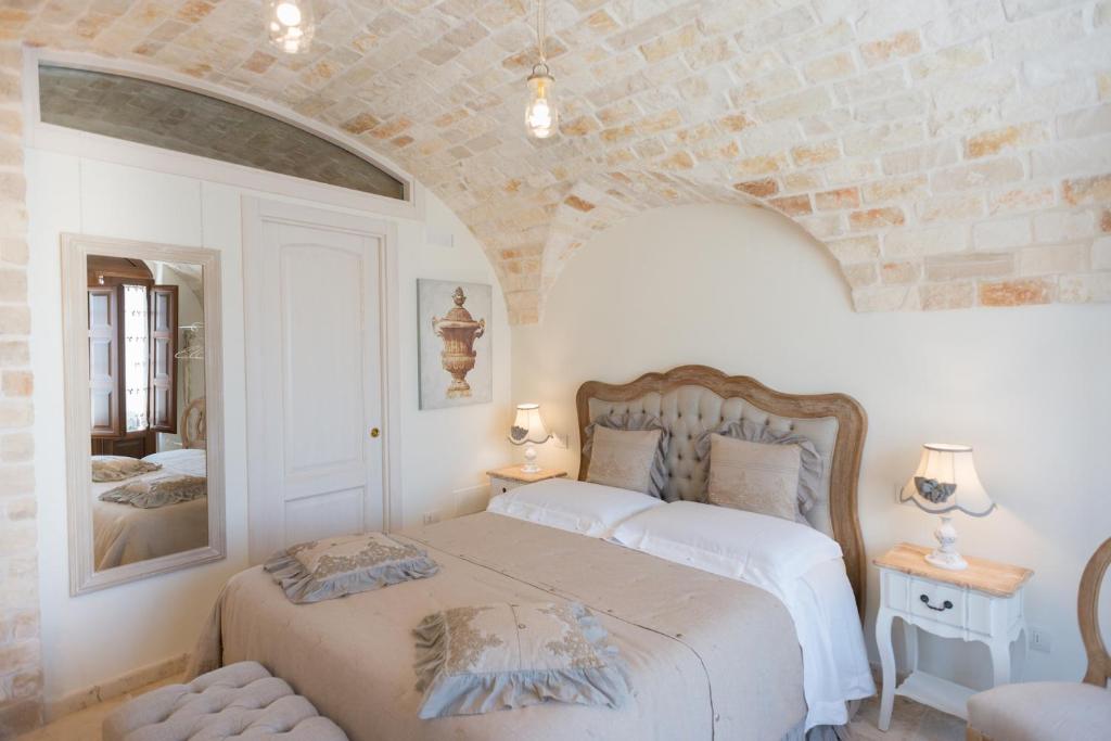 Postel nebo postele na pokoji v ubytování Romantic Trulli