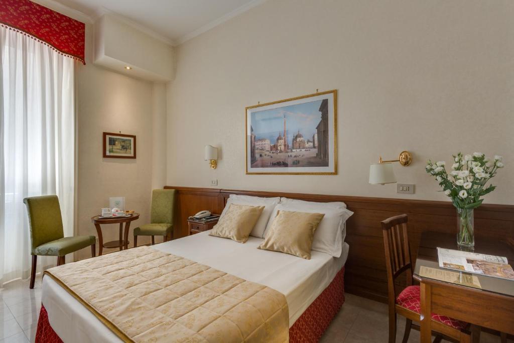 Postel nebo postele na pokoji v ubytování Hotel Silla