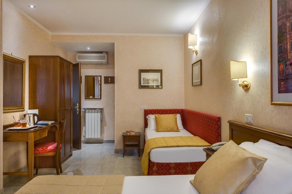 Postel nebo postele na pokoji v ubytování Hotel Silla