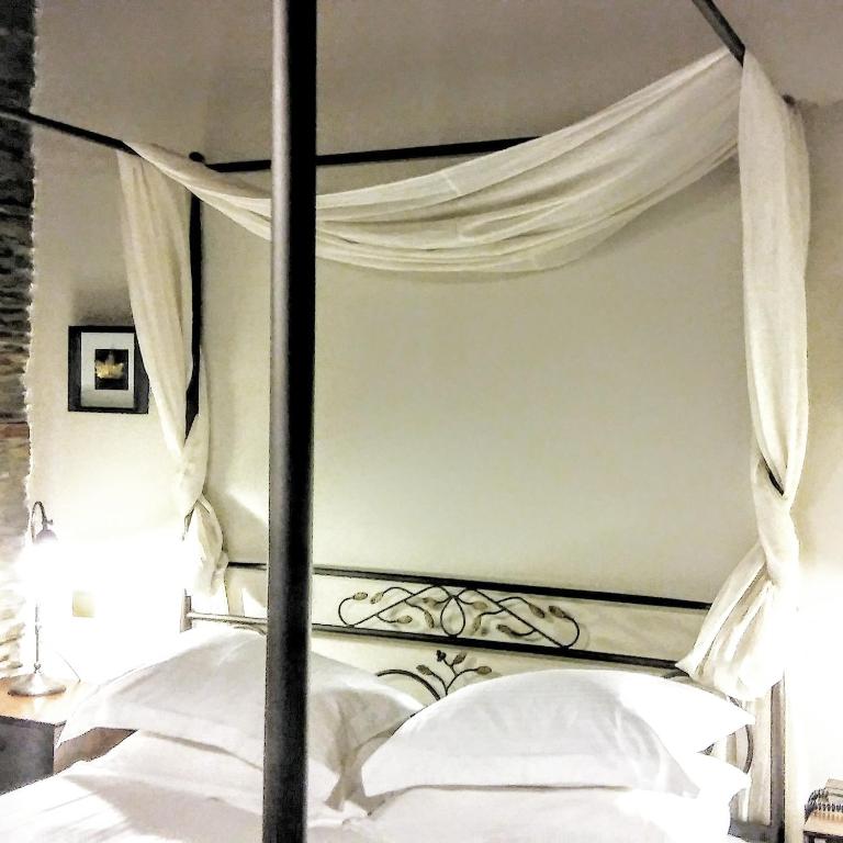 Postel nebo postele na pokoji v ubytování Marelia Hotel