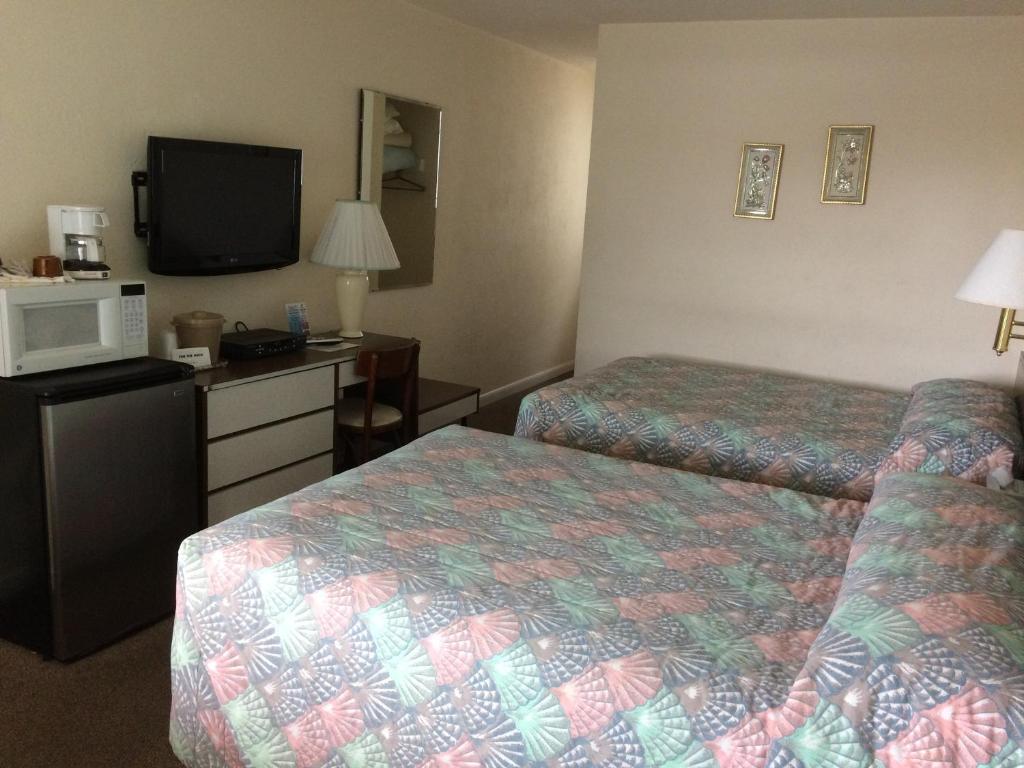 Postel nebo postele na pokoji v ubytování Crystal Sands Motel