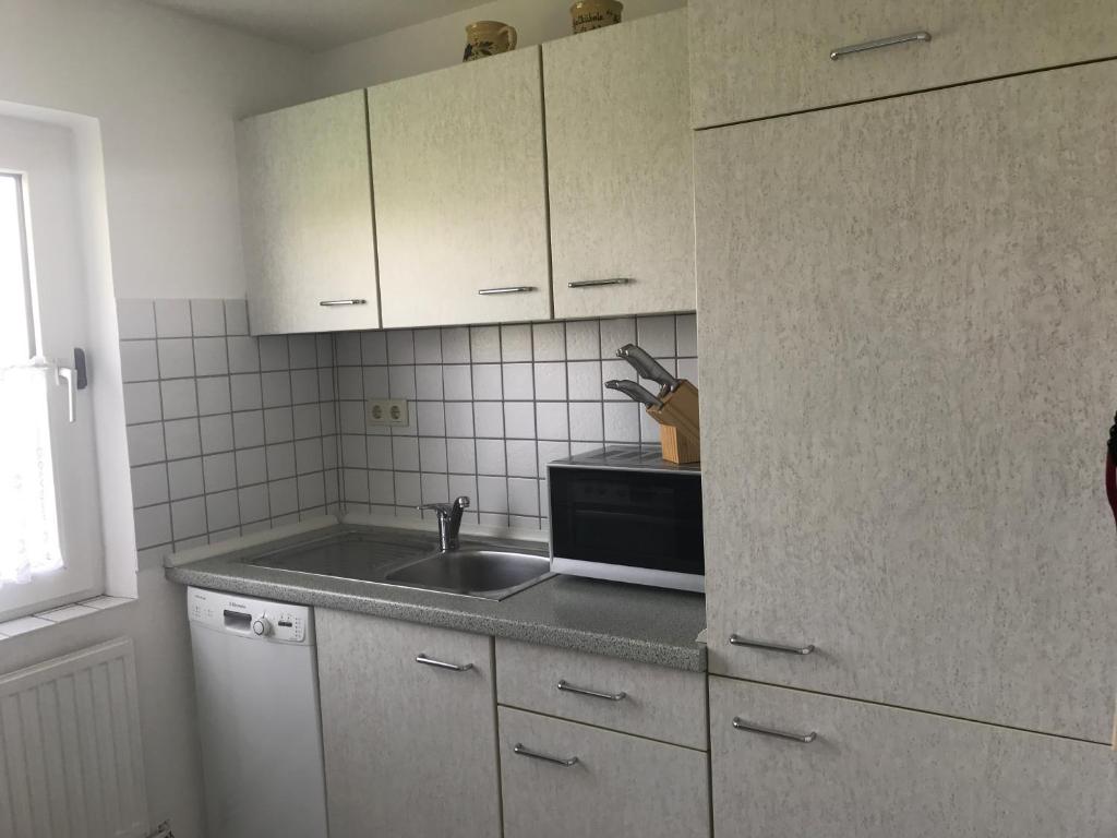 Kuchyň nebo kuchyňský kout v ubytování Haus Heverstrom
