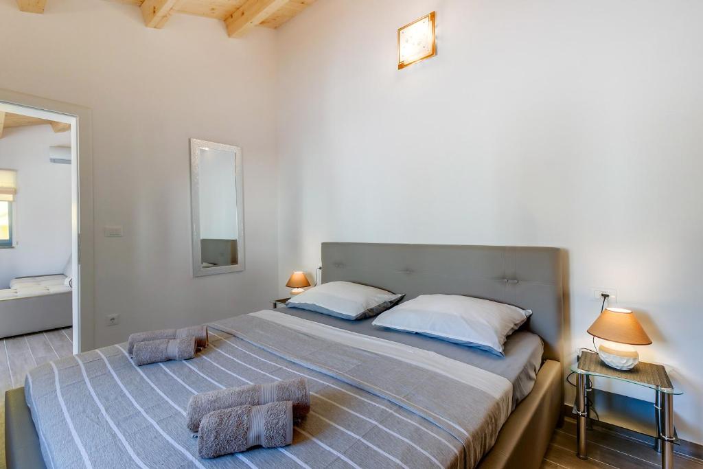 Postel nebo postele na pokoji v ubytování Apartments Relax