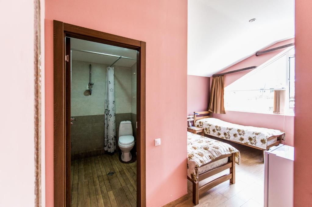 Postel nebo postele na pokoji v ubytování Guest House 15