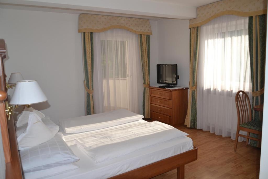 Postel nebo postele na pokoji v ubytování Hotel Scoiattolo