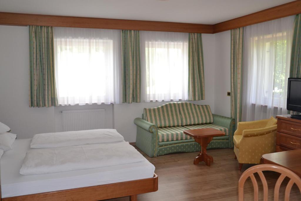 Postel nebo postele na pokoji v ubytování Hotel Scoiattolo