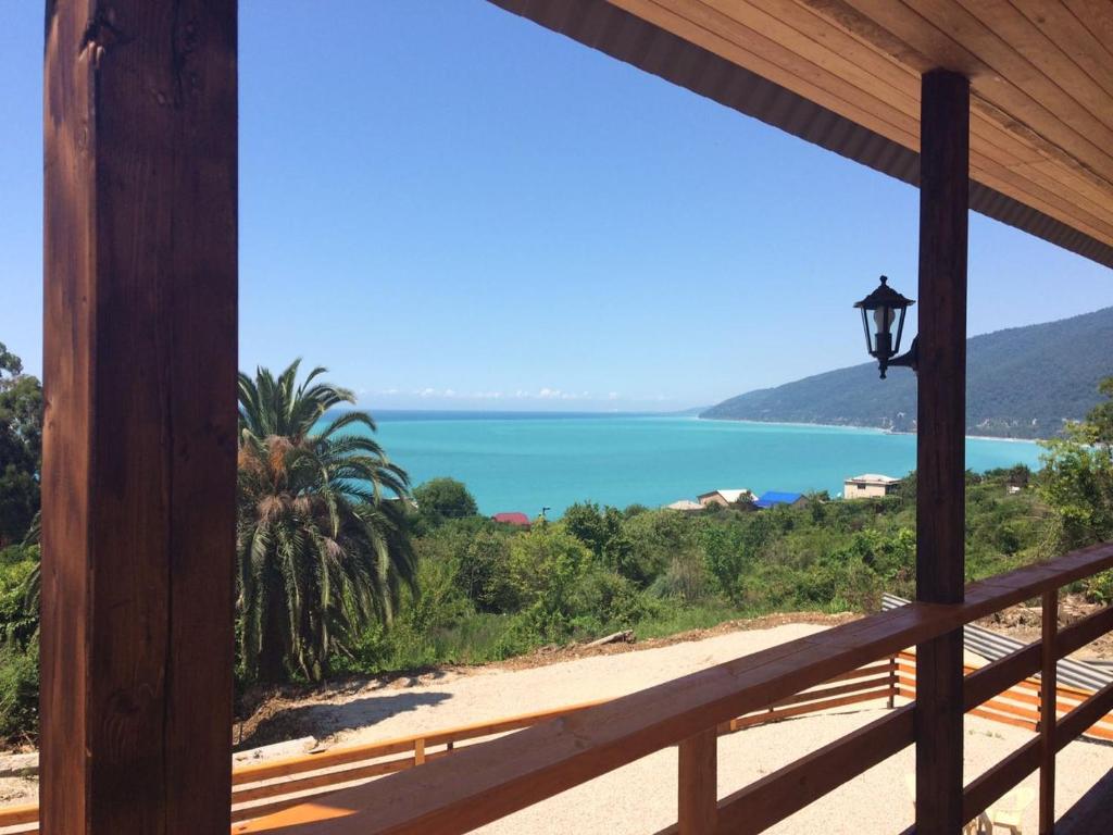 a view of the beach from a house balcony at Guest House on Sovhoznaya in Gagra