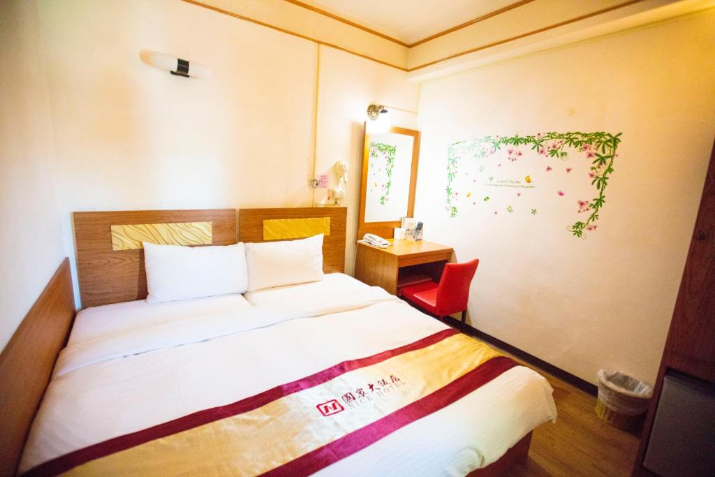 Postel nebo postele na pokoji v ubytování Nice Hotel