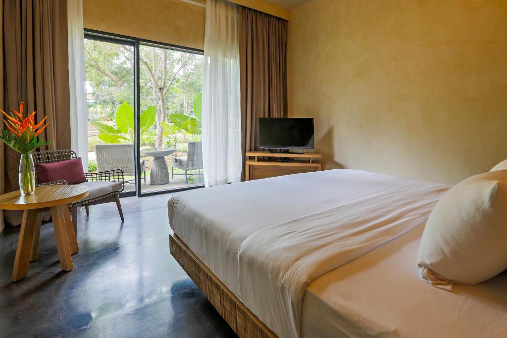 Postel nebo postele na pokoji v ubytování Amorita Resort Bohol