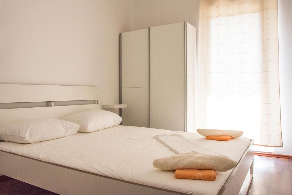Postel nebo postele na pokoji v ubytování Rezidencija AB