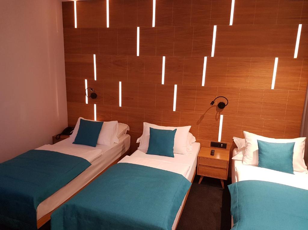 Postel nebo postele na pokoji v ubytování Hotel Sana