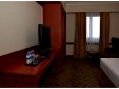 TV a/nebo společenská místnost v ubytování Abadi Suite Hotel & Tower