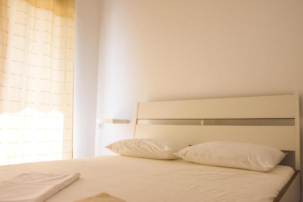 Postel nebo postele na pokoji v ubytování Rezidencija AB