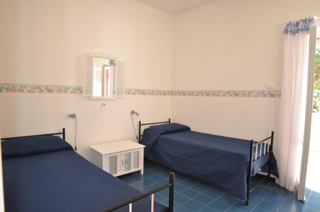 Postel nebo postele na pokoji v ubytování Villa Azzurra