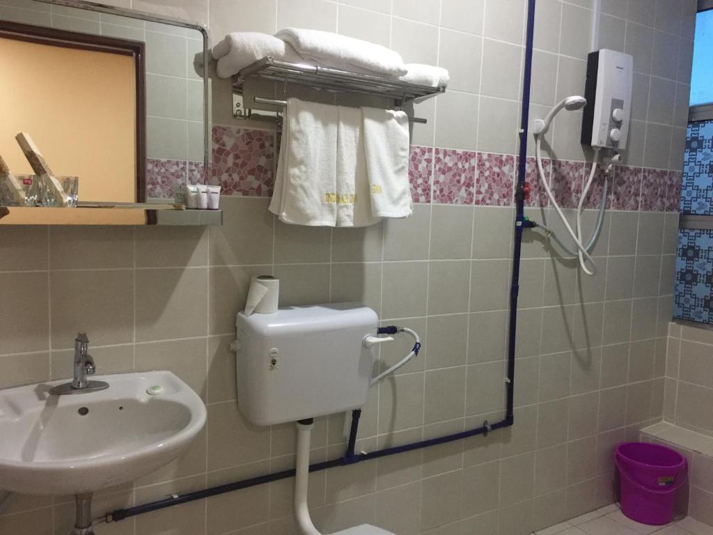 Koupelna v ubytování Indah Inn