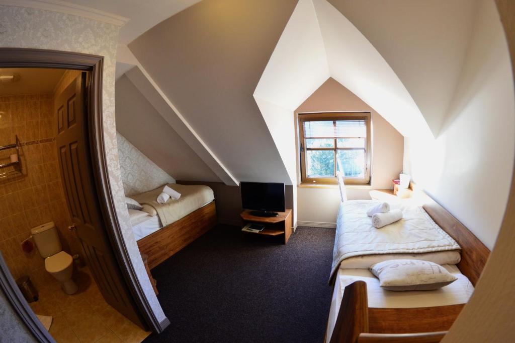 Postel nebo postele na pokoji v ubytování Bonato Hotel