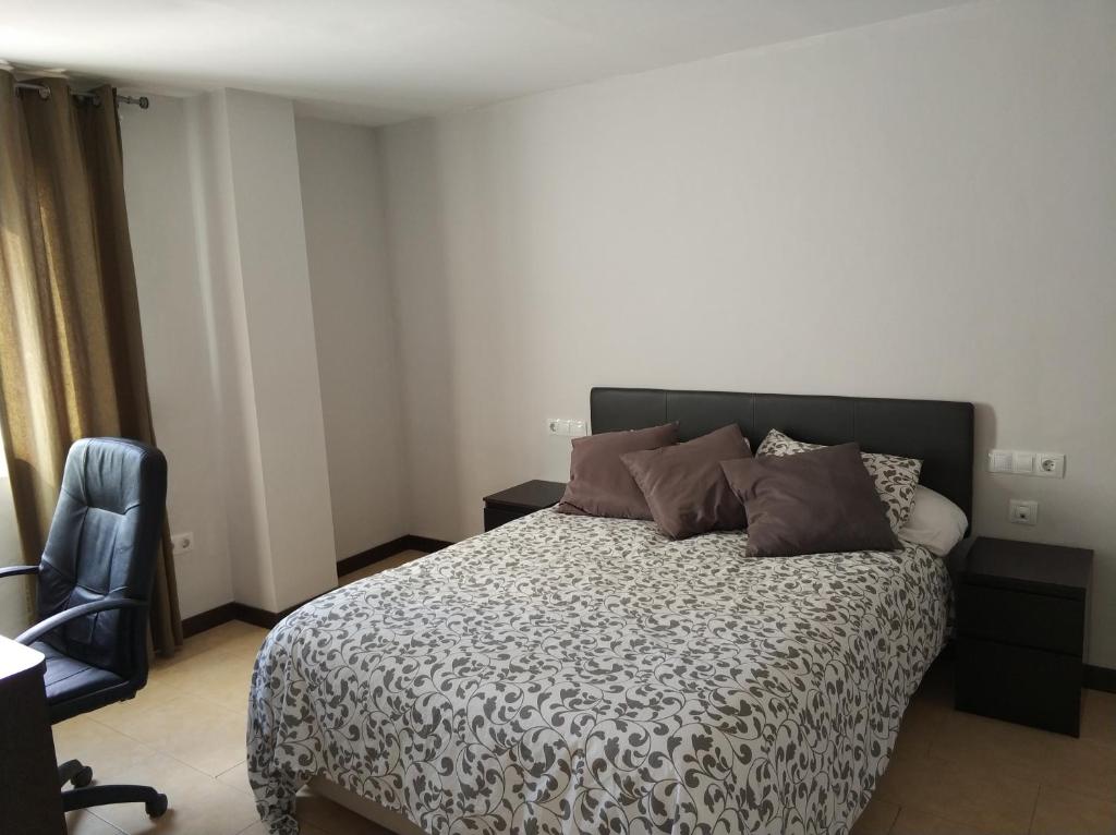 Posteľ alebo postele v izbe v ubytovaní Apartamento Comedias
