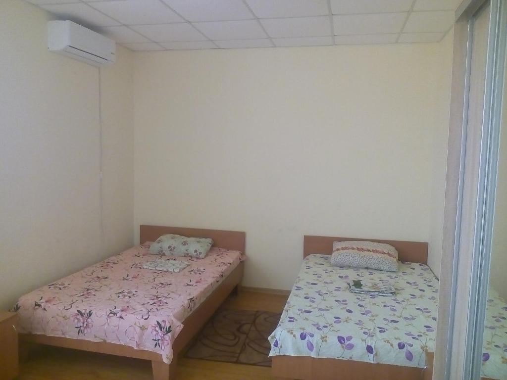 Postel nebo postele na pokoji v ubytování Hotel Uyut