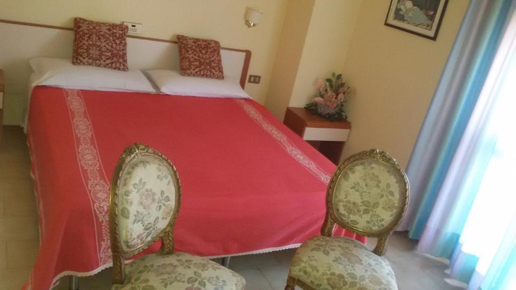 Postel nebo postele na pokoji v ubytování Hotel Le Vigne