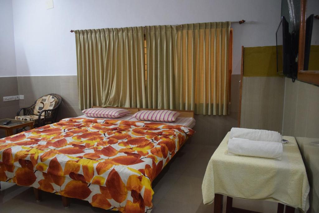 Letto o letti in una camera di Vinodhara Guest House