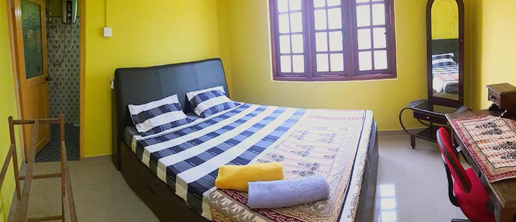 Postel nebo postele na pokoji v ubytování Apple Sara Home Stay