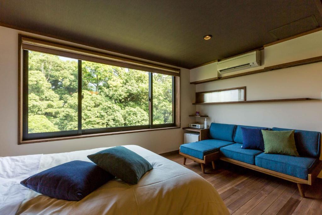 Postel nebo postele na pokoji v ubytování Ryokan Oomuraya