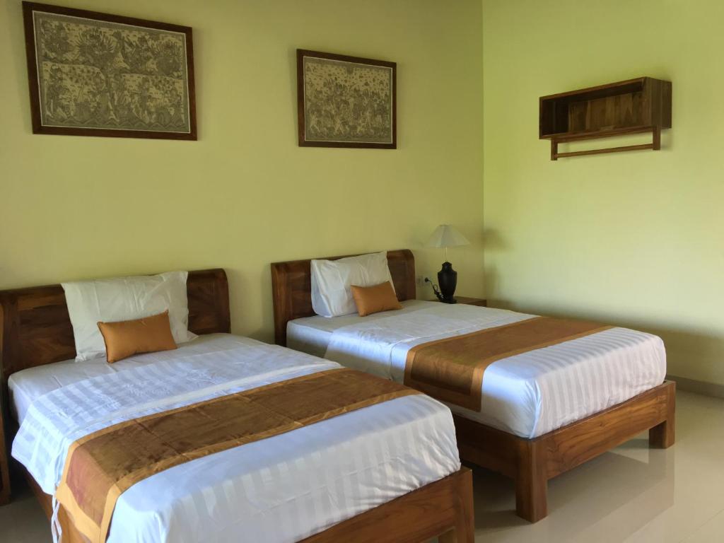 Postel nebo postele na pokoji v ubytování Raka Rai Bungalows