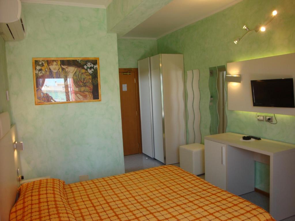 Postel nebo postele na pokoji v ubytování Hotel Prestigio