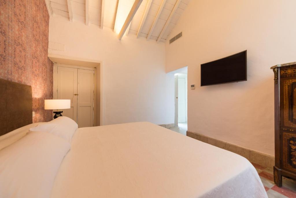 Postel nebo postele na pokoji v ubytování Villa Hacienda de la Guirra