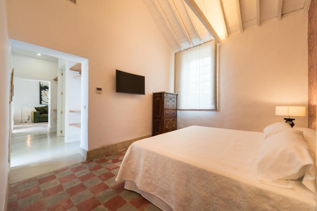 Postel nebo postele na pokoji v ubytování Villa Hacienda de la Guirra