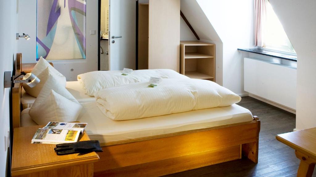 Postel nebo postele na pokoji v ubytování Hotel Landgasthof Koechlin