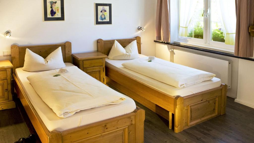 Postel nebo postele na pokoji v ubytování Hotel Landgasthof Koechlin