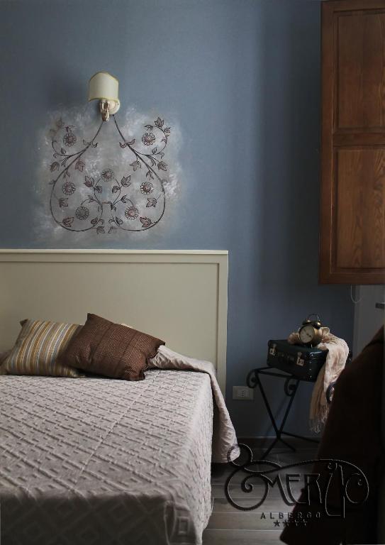 Postel nebo postele na pokoji v ubytování Albergo Merùo