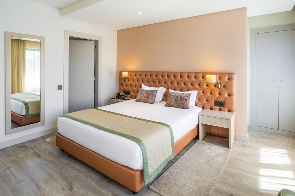 Postel nebo postele na pokoji v ubytování Empire Lisbon Hotel