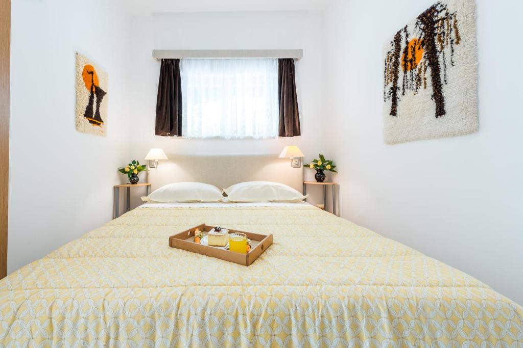 Postel nebo postele na pokoji v ubytování K&L central apartments