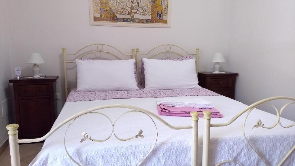 Postel nebo postele na pokoji v ubytování Agriturismo Le Scerze