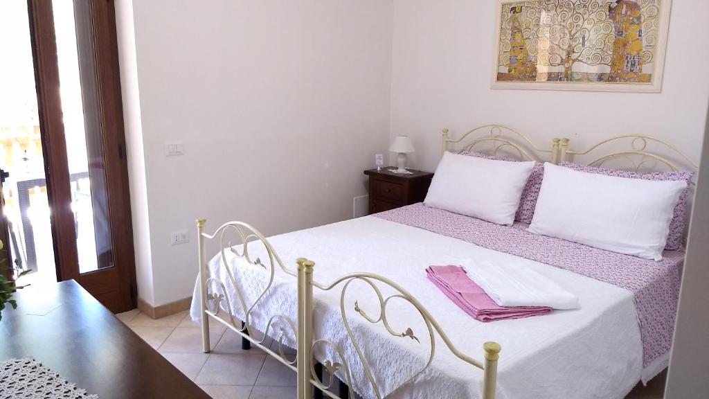 Postel nebo postele na pokoji v ubytování Agriturismo Le Scerze