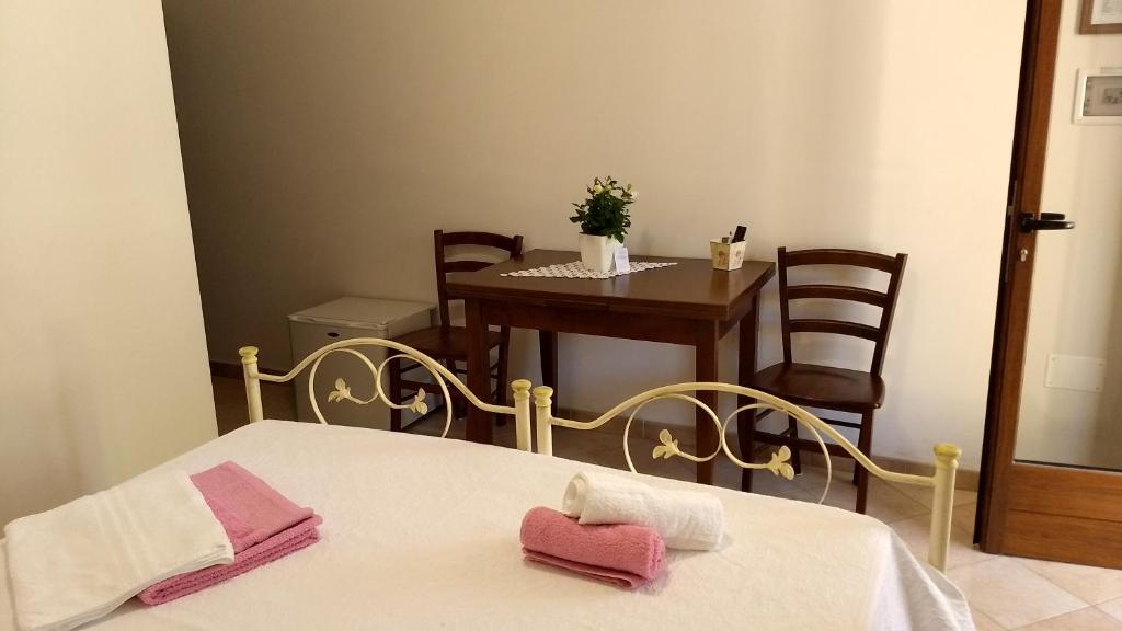 Postel nebo postele na pokoji v ubytování Agriturismo Le Scerze