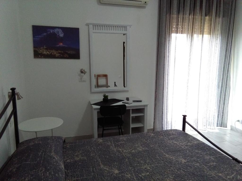 Postel nebo postele na pokoji v ubytování Caltagirone Casa Serena