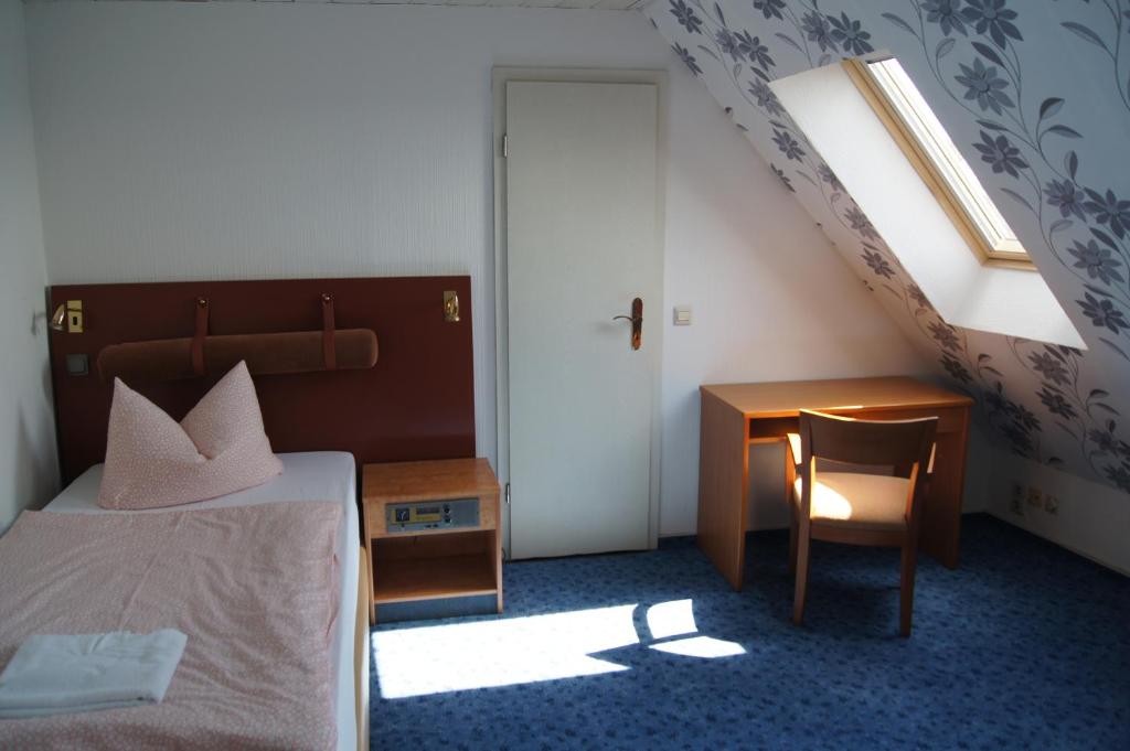 Postel nebo postele na pokoji v ubytování Hotel Draschwitz