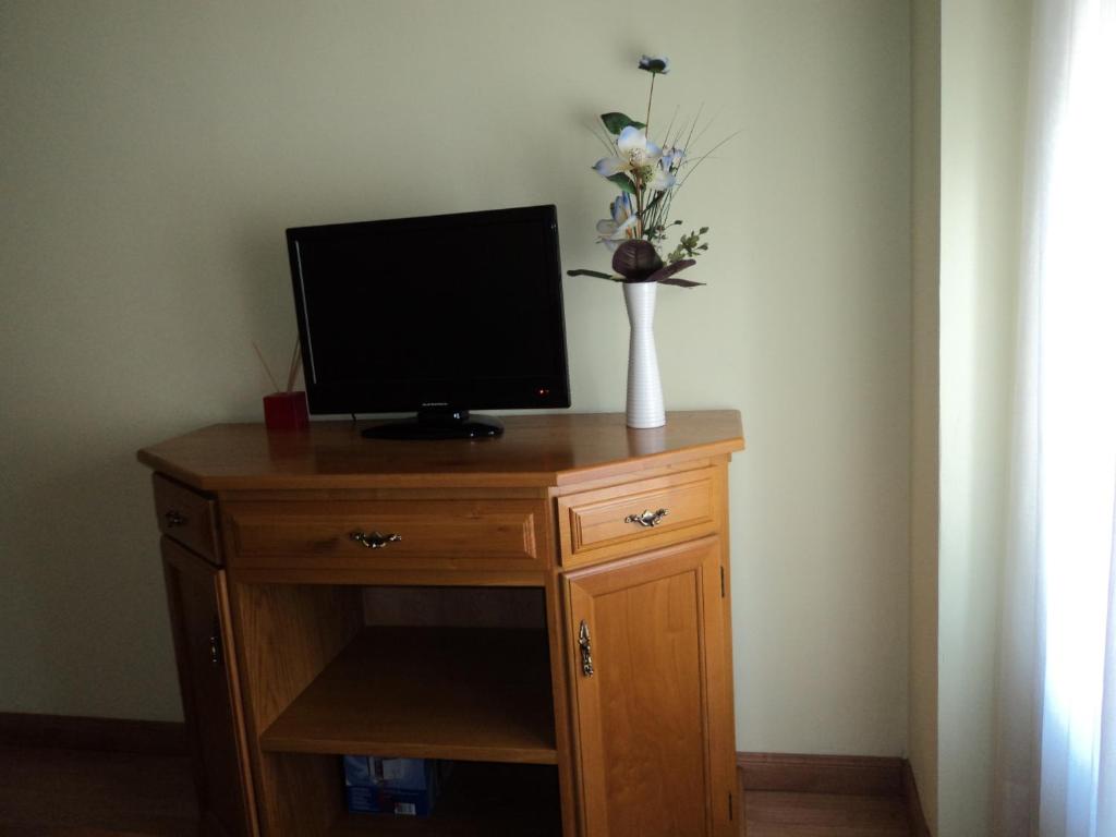 TV a/nebo společenská místnost v ubytování Apartamentos Casa Rosendo
