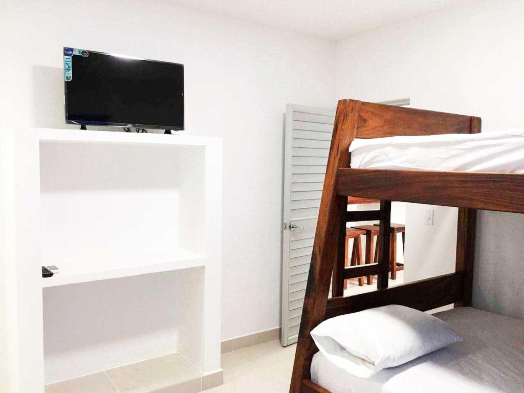 Postel nebo postele na pokoji v ubytování Cabañas Aqua Blue