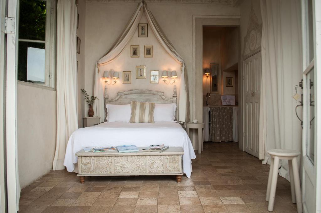 Postel nebo postele na pokoji v ubytování Villa Caprichosa Boutique Hotels