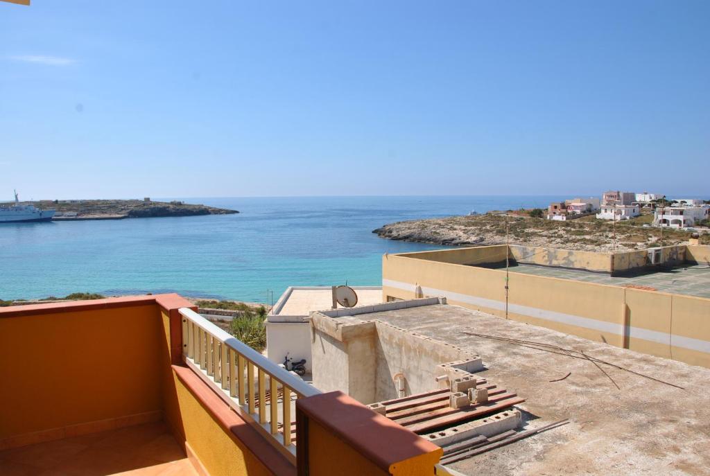 a view of the ocean from the balcony of a building at Attico Vista Mare in Lampedusa