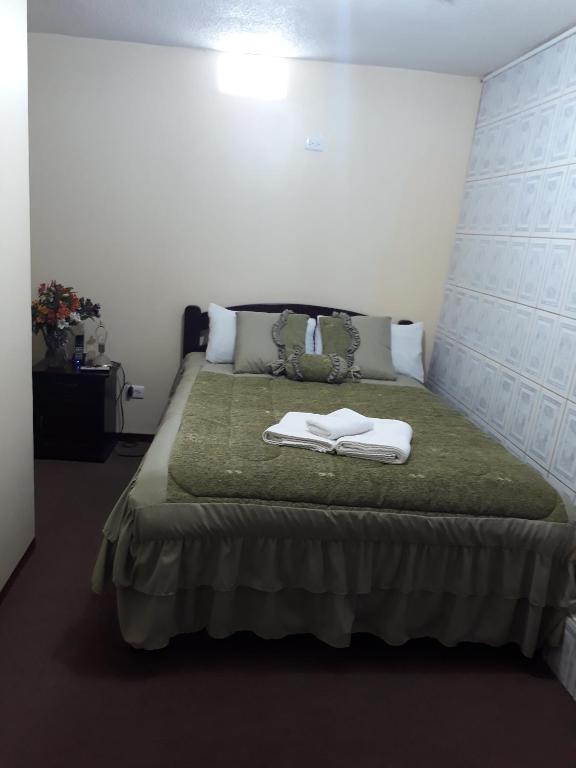 Postel nebo postele na pokoji v ubytování Hotel Residencial El Viajero