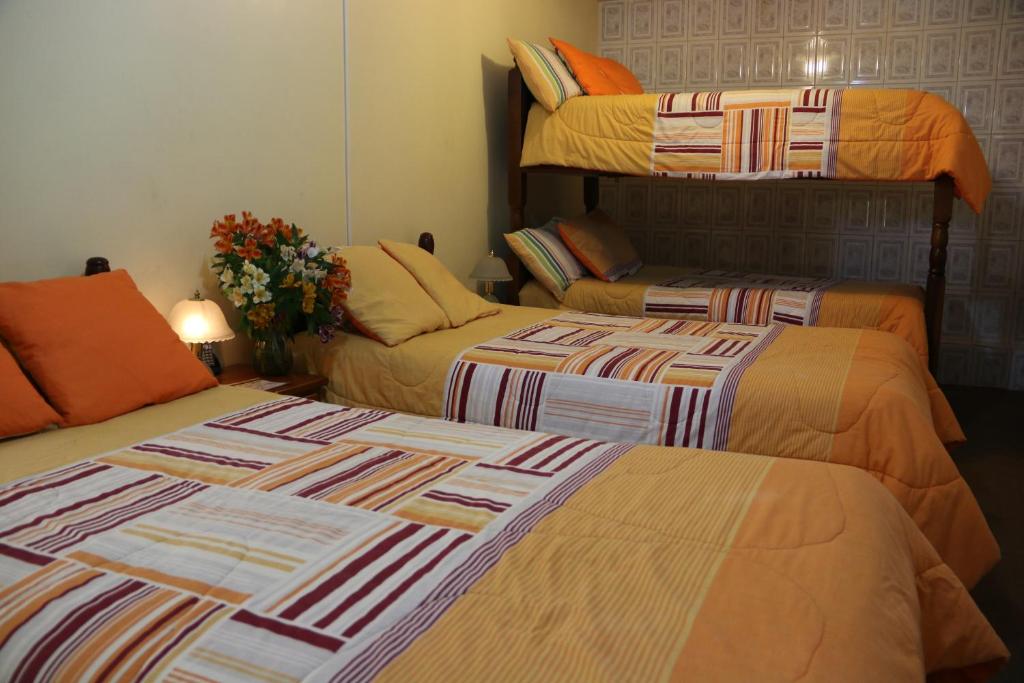 Postel nebo postele na pokoji v ubytování Hotel Residencial El Viajero
