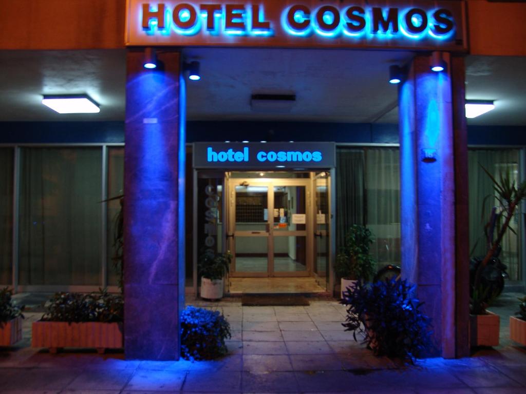 a hotel room with a hotel entrance with blue lights at Hotel Cosmos in Athens