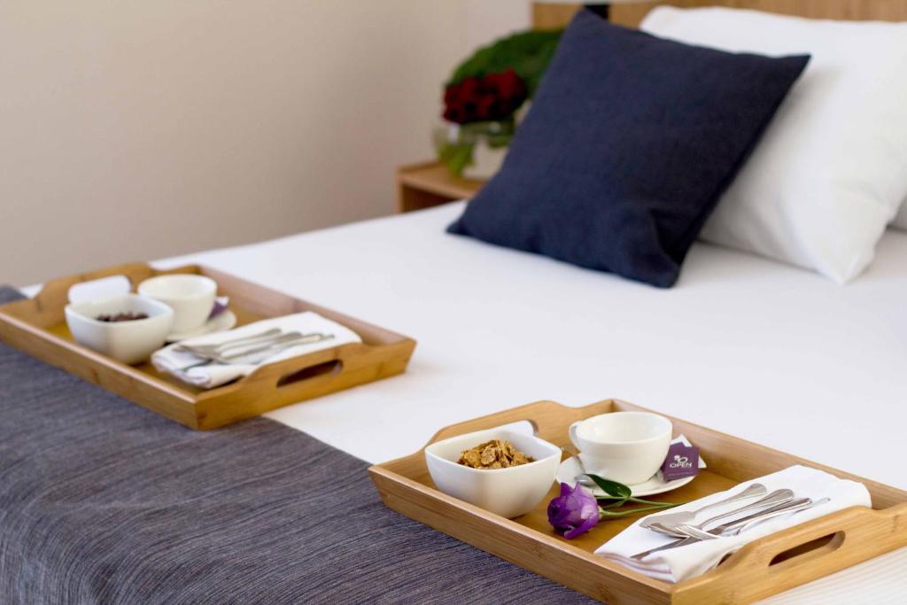 Postel nebo postele na pokoji v ubytování Open Hotel
